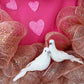 Romantic pink heart shaped wreath with birds